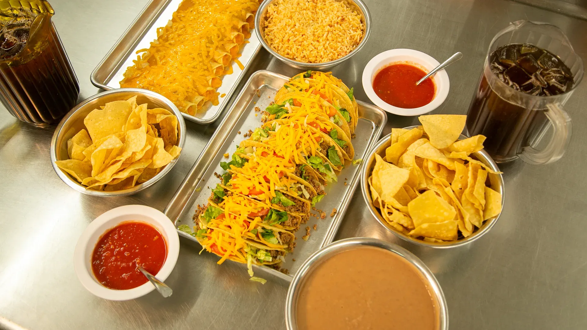 A Leal's family-size order — tray of plates with sides, ready for an office lunch or a holiday table