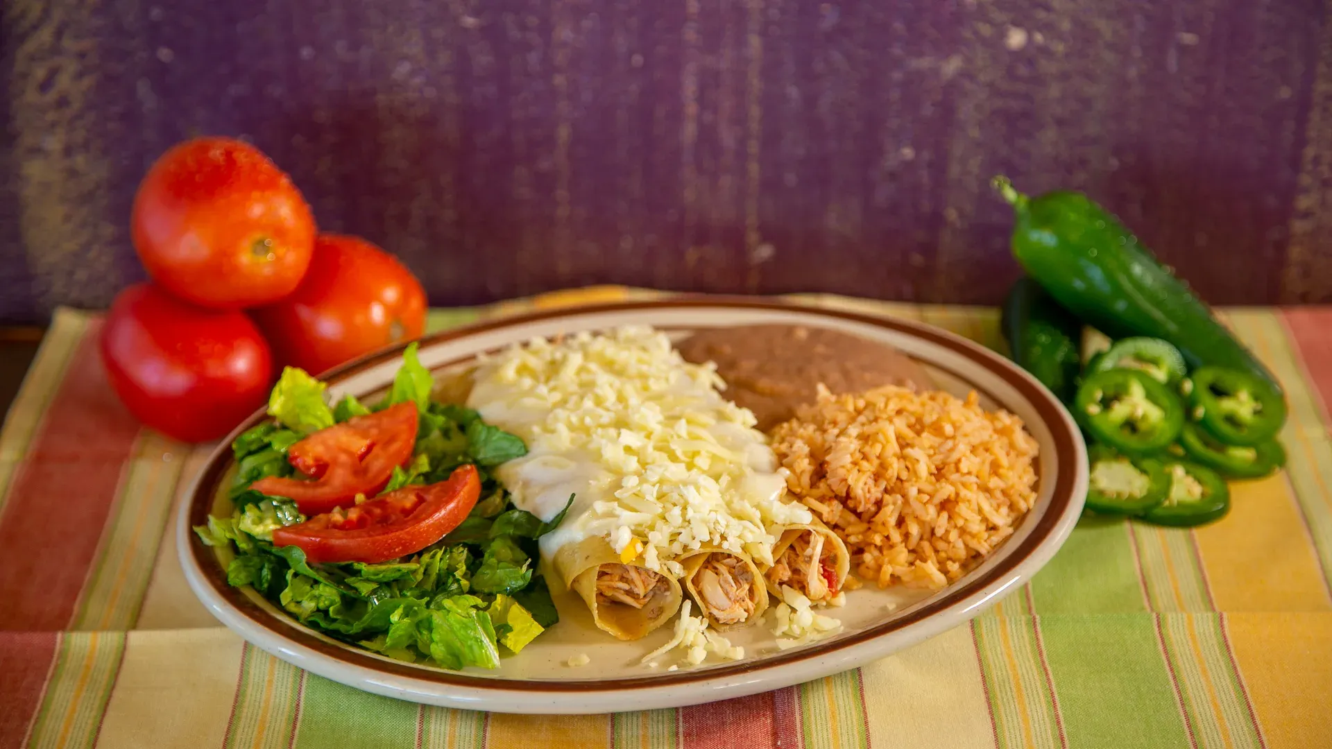Sour cream chicken enchiladas with rice and beans at Leal's Tamale Factory in Lubbock